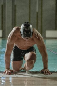 Pellea Fitness - Toronto Canada - Fitness Activity - Man Swimmer Getting Out Of Pool